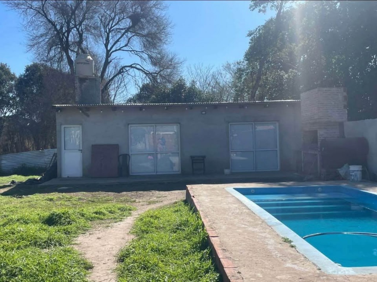 Maximo Paz, amplio terreno de 1300 m2, quincho de material, pileta.